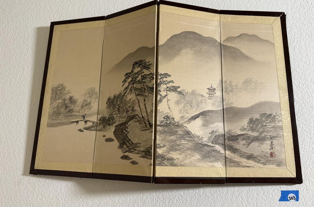 Asian ink-wash mountain landscape displayed across four folding panels
