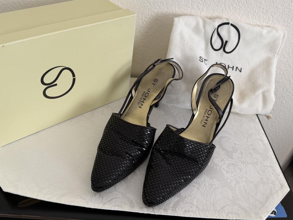 St. John black sequin pointed-toe slingback pumps displayed with a branded box and white dust bag.