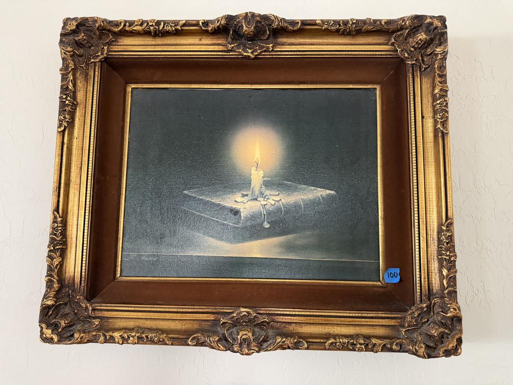 Lot 100: Teimur Amiry Candlelight Reading oil painting depicting a glowing candle above a book in an ornate gold-toned frame.