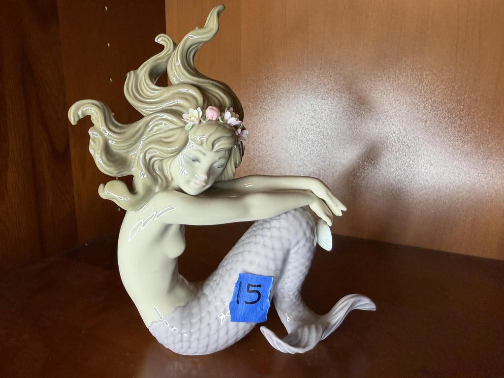Lot 15: Lladró Illusion porcelain mermaid with flowing hair, pink flowers, and a curled lavender tail.