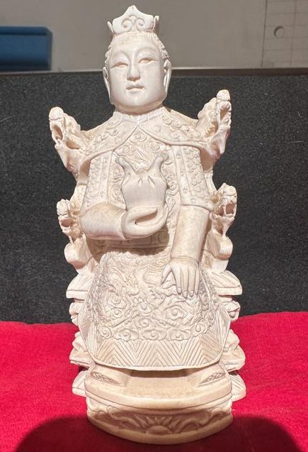 Asian carved deity seated on a dragon throne with patterned robes, Lot 249 in the Burlwood and Collectibles Auction.