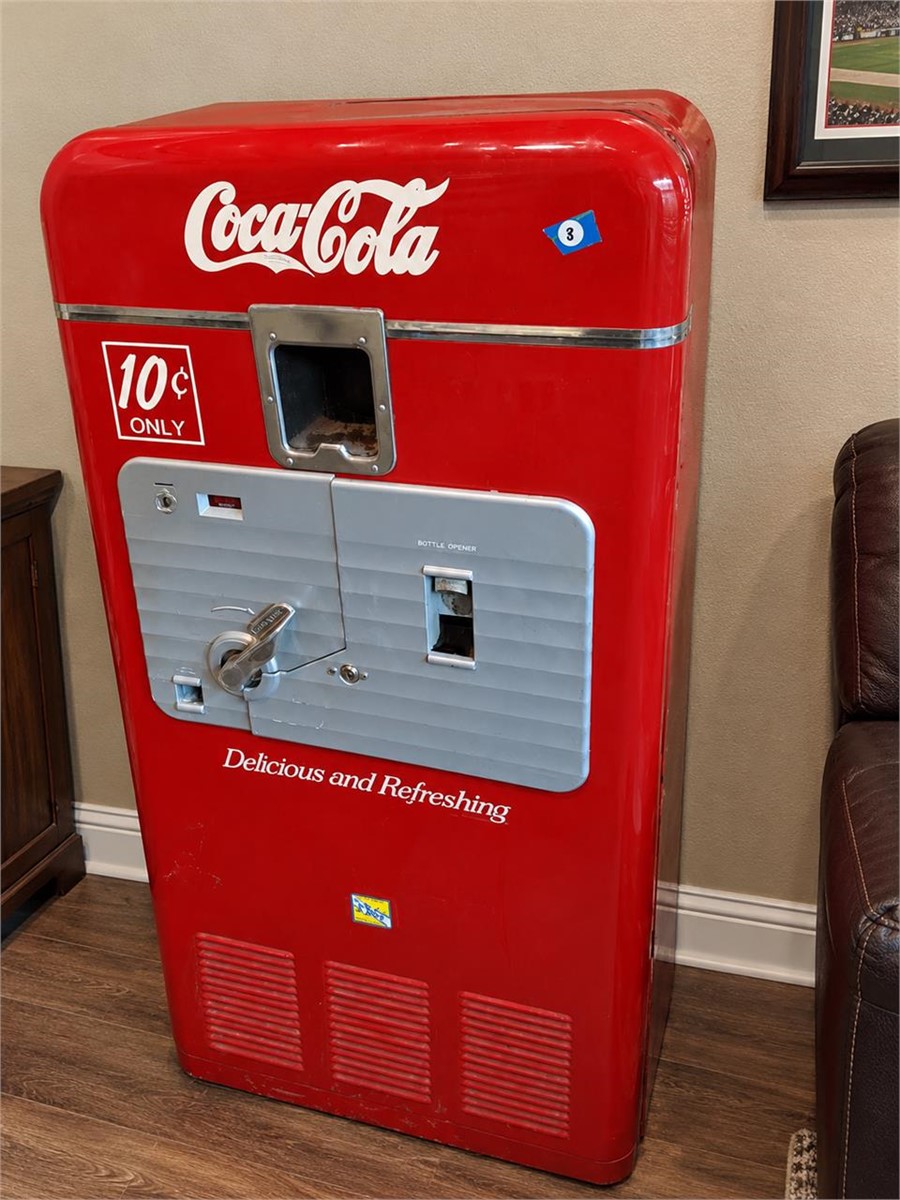 Red Coca-Cola vending machine with silver front and 10-cent sign in the Burlwood and Collectibles Auction.